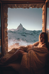 Woman tourist selfie near the Matterhorn mountain.Famous popular touristic place in the world.