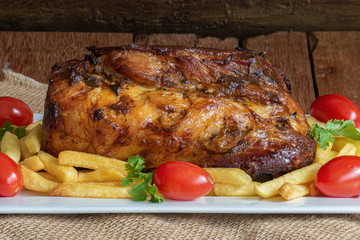 Juicy roast meat on a rustic wooden background.