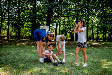 Fototapeta premium Worried boy and his school friends during physical education classes