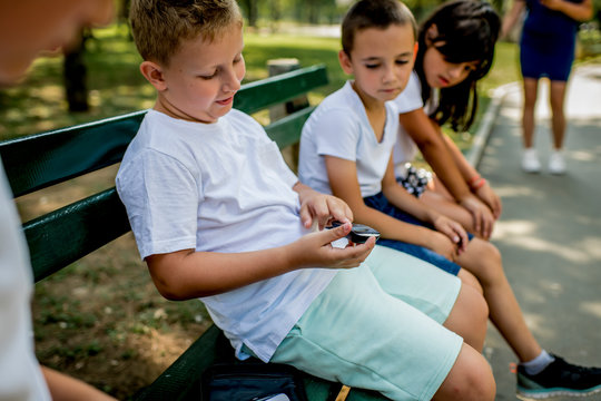 School Boy With Diabetes Testing His Blood Sugar After Physical Education, Friends Support Him.