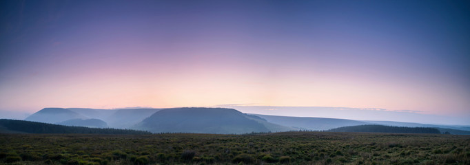 The colors of the sunrise. Panorama of Brecon Beacons National Park in Wales.