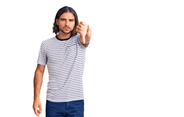 Fototapeta premium Young handsome man wearing casual clothes looking unhappy and angry showing rejection and negative with thumbs down gesture. bad expression.