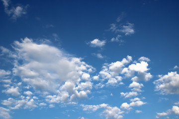 Naklejka na ściany i meble Blue sky with white clouds. Nature background
