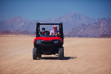 riding a buggy car through the desert. thrill tourism adventures
