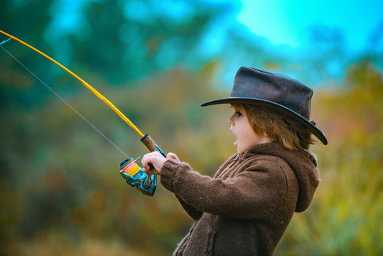 Kid fishing with spinning reel. Kids fly fishing.