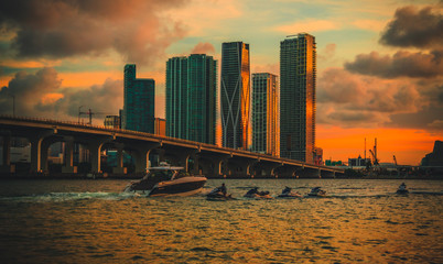 sunset over the city Miami Florida buildings boats bridge sky 