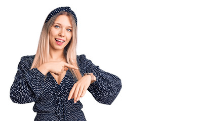 Young beautiful blonde woman wearing casual clothes in hurry pointing to watch time, impatience,...
