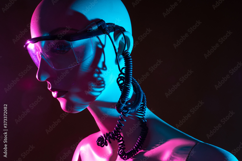Poster humanoid cyborg with wires coming out of his head. close-up portrait of a cyborg. glasses on face of