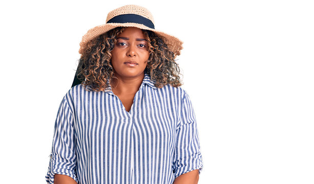 Young african american plus size woman wearing summer hat depressed and worry for distress, crying angry and afraid. sad expression.