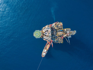 Aerial view from a drone of an offshore jack up rig at the offshore location during day time