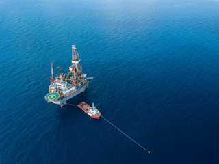 Aerial view from a drone of an offshore jack up rig at the offshore location during day time