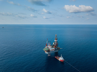 Aerial view from a drone of an offshore jack up rig at the offshore location during day time