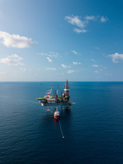 Aerial view from a drone of an offshore jack up rig at the offshore location during day time