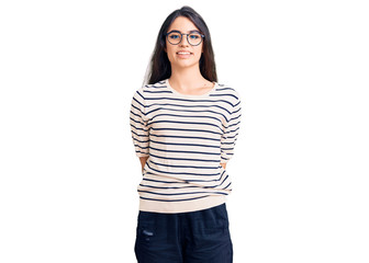 Brunette teenager girl wearing casual clothes and glasses with a happy and cool smile on face. lucky person.