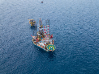 Aerial view from a drone of an offshore jack up rig at the offshore location during rig move