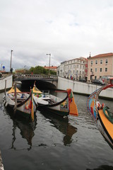 Fototapeta premium Traditional boats, Colorful Moliceiro boat, on the canal in Aveiro, Portugal.