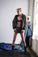 Portrait of a young, urban, androgynous woman.