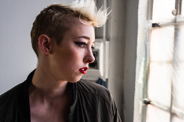 Portrait of a young, urban, androgynous woman.