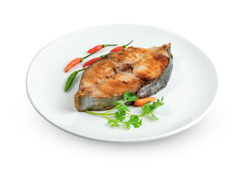 King mackerel or spotted mackerels steak with dish isolated on white background ,fried Scomberomorus fish ,include clipping path