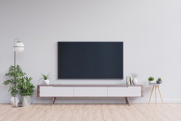 TV on the cabinet in modern living room on white wall background.