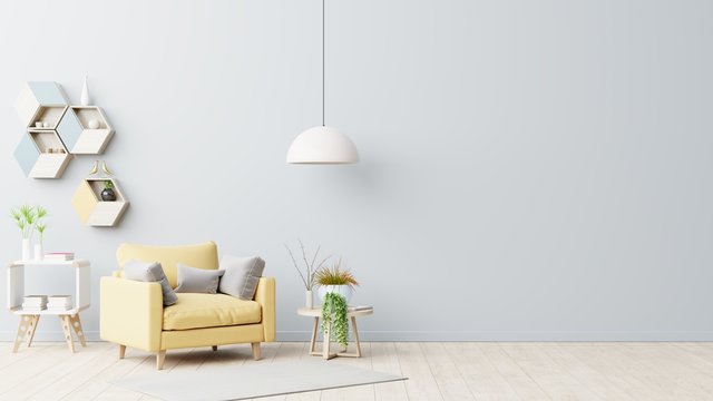The interior has a yellow armchair on empty gray wall background. © Vanit่jan