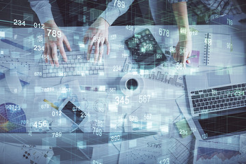 Double exposure of man and woman working together and data theme hologram drawing. Computer background. Top View.