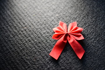 Red bow on black background 2