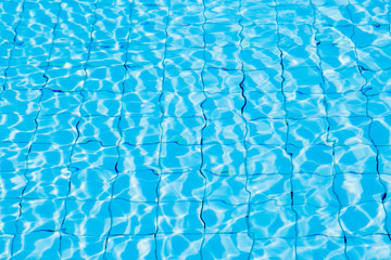 Blue ripe water reflection in swimming pool