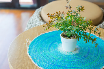 Fake flower vase in coffee shop