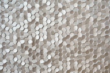 Obraz na płótnie Canvas Silver yellow hexagonal mosaic tiles for texture background.