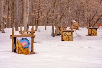 Winter archery targets in snowy forest