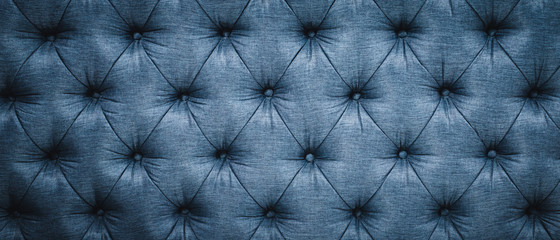 Vintage sofa button backrest of blue in texture. Wallpaper. for pattern and background.