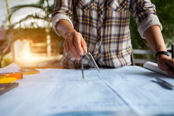 Engineers are writing home construction designs to bring them to prospective customers.concept