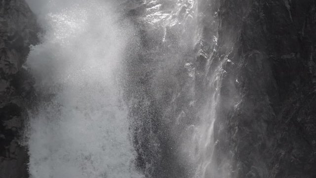 Detail static slowmotion shot of how the water breaks against the rocks of the Cascade de la Pisse. French Alps. Pro Res