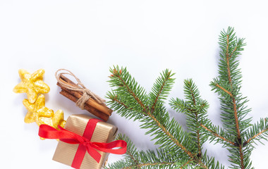 christmas tree with gift box and cinnamon. Christmas greeting card on white background.