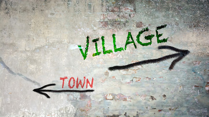 Street Sign to Village versus Town