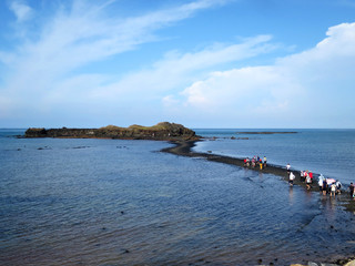 Visitors walk a underwater pathway known as the “Moses Parts the Sea” (奎壁山摩西分海) in Penghu County, TAIWAN