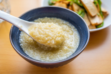 Millet porridge in a bowl on wooden table