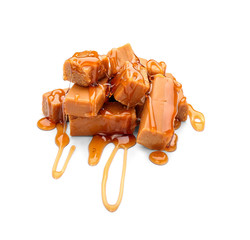 Tasty caramel candies isolated on white