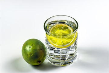 Lemon, ice cubes and water 