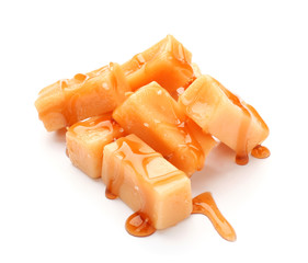 Tasty caramel candies isolated on white