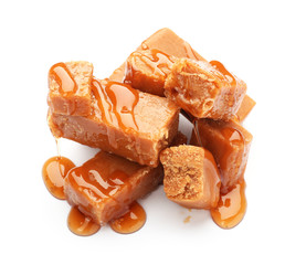 Tasty caramel candies isolated on white