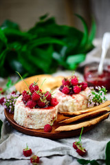 Farmer camembert cheese on the cutting board. selective focus