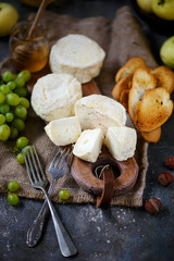 Farmer camembert cheese on the cutting board. selective focus