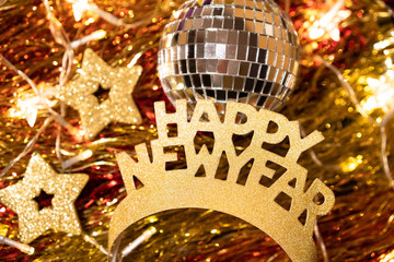 Happy New Year crown and disco ball.