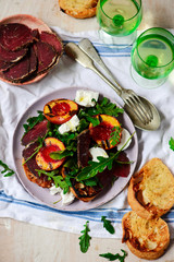 Grilled peaches, goat cheese, and bresaola salad..