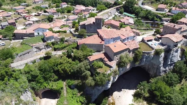 Rotating aerial view of natural bridge in Puentedey, Burgos