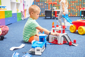 little caucasian boy playing educational games