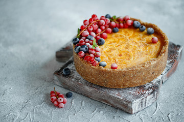 Cheesecake cake with berries. Cake with delicate curd and dough base. High quality photo.