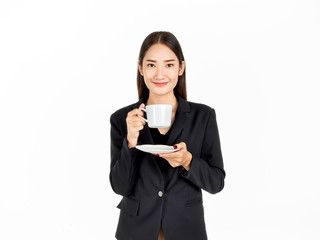 Young Asian smiling businesswoman in suit drinking coffee isolated on white background.